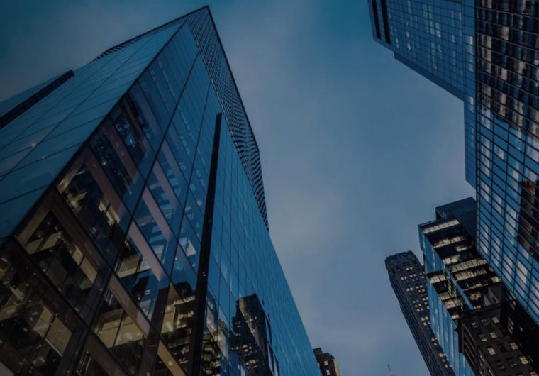 A background image for NewDevRev of skyscraper buildings